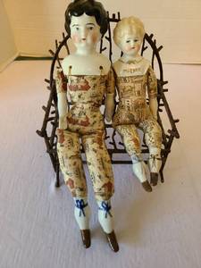 lot 1044 image: 2 Porcelain Dolls with Printed Clothing and Metal Twig Chair