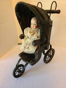 lot 1049 image: Porcelain Doll in Pram with Black Canopy and Lace Dress