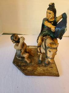 lot 1051 image: Figurine Sculpture Seated Figure on Horse with Attendant, possibly paper mache, broken in a couple of places