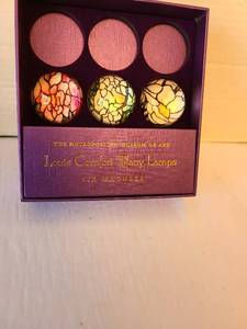 lot 1062 image: Louis Comfort Tiffany Lamps Magnets The Metropolitan Museum of Art, 3 magnets