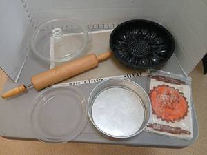 lot 1244 image: Baking lot Rolling Pin, cookie sheets,  decorative  pan, glass dish with lid,