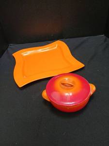 lot 1310 image: Le Creuset  with lid  number 12 on bottom, with orange plate
