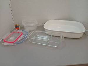 lot 1359 image: French white Corning Ware casserole dish with glass and plastic containers with snap on lids