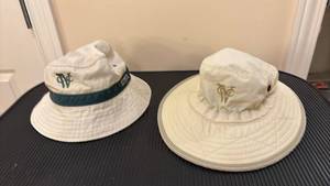 lot 1491 image: Two White Bucket Hats with Embroidered Logo
