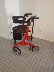 lot 2025 image: The Nitro Walker by Drive.  4 Wheels, Nice Seat and Nice Storage Bag.  Comes with cane.   Located in basement