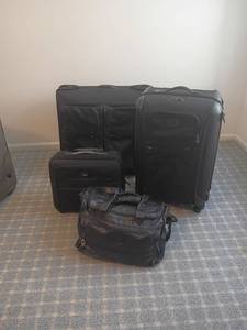 lot 2029 image: 4pcs.  Tumi Luggage Set.   Located in basement