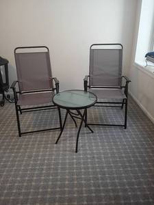 lot 2033 image: 2 Outdoor Chairs with Table.   Table is 20 x 18.  Located in basement