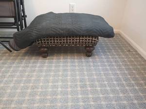 lot 2034 image: Ottoman 10 x 22 x 18 and Moving Blanket.   Located in basement