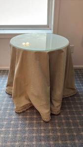 lot 2106 image: Round Glass Top Side Table with Checkered Fabric Skirt 24x24x24in