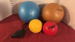lot 2147 image: Exercise Stability Balls and Soft Weight Balls Lot - Blue, Orange, Yellow, Red
