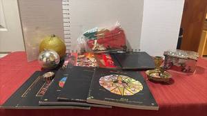 lot 2249 image: Assorted Christopher Radko Collectors Catalogs, Wooden Santa Puzzle, and More