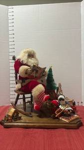 lot 2263 image: Rockin Santa Claus on Wooden Display