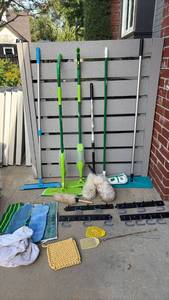 lot 3005 image: Mops, Shoe Covers, Garage Hooks, and More