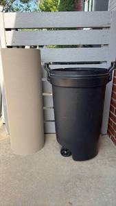 lot 3010 image: Outdoor Plastic Trash Can with Wheels and Ram Board Temporary Floor Protection