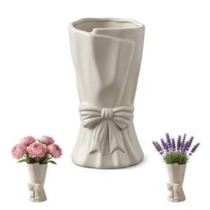 lot 396 image: Cream Ceramic Bow Vase, Decorative White Flower Vase for Table Centerpiece, Elegant Cream Ceramic Vase with Bow Design for Home, Office, Wedding Decor