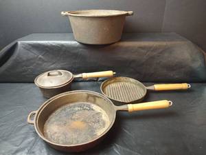 lot 239 image: WKM Cast Iron Cookware Set - Dutch Oven, Fry Pan, Grill Pan & Saucepan