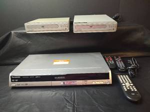 lot 266 image: Panasonic Recorder with Two Magnavox DVD Players and Remote Controls