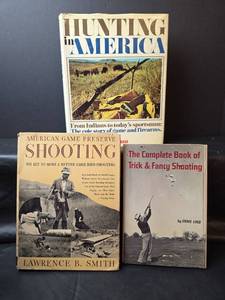 lot 353 image: Hunting in America by Charles E. Waterman, American Game Preserve Shooting by Lawrence B. Smith, The Complete Book of Trick & Fancy Shooting by Ernie Lind