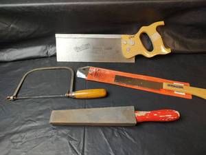 lot 434 image: Saws and Whetstone