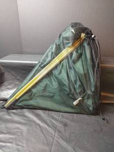 lot 773 image: Green Pop-Up Camping Shelves with Carrying Case, 27w x 16d x38t and Poncho Liner, Used as Blanket, Missing Original Liner Piece