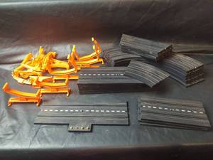 lot 799 image: Slot Car Track Set Orange Clamps with Black Road Sections