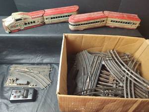 lot 803 image: Vintage Union Pacific Tin Toy Train Set and Track, Engine Missing Parts