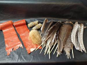 lot 843 image: Feathers, Snake Skin, Fur Pom and Rolled Skin Pieces