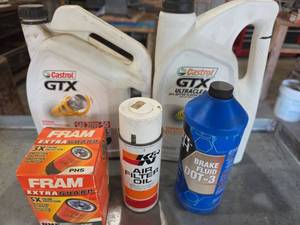lot 1005 image: Castrol GTX Motor Oil, K&N Air Filter Oil, FRAM Oil Filter, Brake Fluid Lot