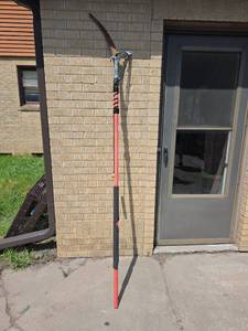 lot 1033 image: Curved Pruning Saw with Red and Black Handle