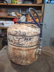 lot 1130 image: 12 Refrigerant Cylinder Empty