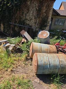 lot 1223 image: Mixed Metal Scrap Lot- Drums Pipes Flat Stock Angle Iron Bricks Trailer Lawn Machine