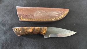 lot 9 image: Fixed Blade Knife with Brown Handle and Leather Sheath