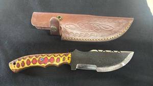 lot 35 image: Fixed Blade Hunting Knife Yellow Red Handle with Leather Sheath