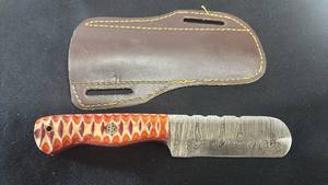 lot 62 image: Hunting Knife with Damascus Blade and Orange Handle with Leather Sheath