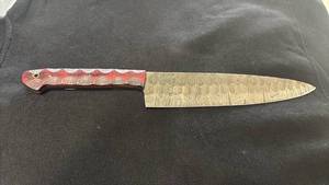 lot 79 image: Chefs Knife with Patterned Blade and Red Handle