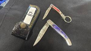 lot 83 image: Lot of 2 Folding Pocket Knives with Leather Sheath