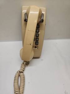 lot 50 image: Cortelco Touchtone Wall Telephone with Handset, Beige