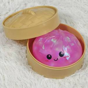 lot 4078 image: Dumpling Squishy Toy Dumpling Stress Ball with Steamer Case, Stress Relief Fidget Toy for Adults, Cute Squeeze Desk Toy Portable Toy Gift Idea (Shimmer Pink)