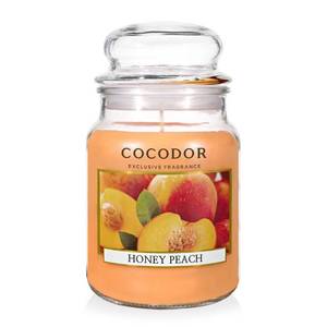 lot 1166 image: COCODOR Candle Honey Peach Scented, Large Glass Jar 18oz Wick Candle, 110 Hours of Burn Time