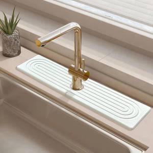 lot 10096 image: Faucet Mat for Kitchen Sink, Diatomite Fast Drying Stone Faucet Mat Sink Super Absorbent Prevents Moisture Buildup Faucet Splash Guard for Bathroom Counter (White, 23.63.9Inch)