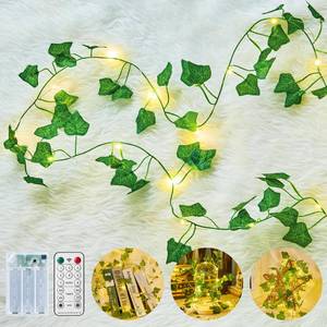 lot 12439 image: Minetom Vine Lights for Bedroom, 21ft 60LED Fairy Lights Battery Operated with Remote Control, 8 Lighting Modes Ivy Vines String Light for Bedroom Room Wall Wedding Christmas, Warm White