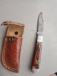 lot 18131 image: MHSCutlery Handcrafted Folding Knife Damascus Blade Red and Yellow Handle with Leather Sheath, 6 Inch