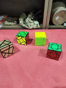 lot 1085 image: Lot of 4 Speed Cubes Rubiks Style Puzzle Cubes