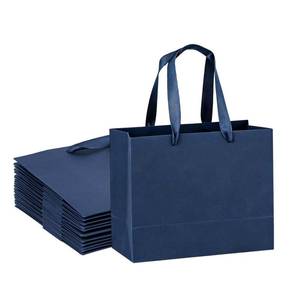 lot 73486 image: Navy Blue Gift Bags 12 Pack, 8.7x3.9x7.1 Inches Paper Gift Wrapping Bags with Ribbon Handles, Blue Shopping Bags Kraft Bags for Wedding, Party, Packing, Retail - Retail $17