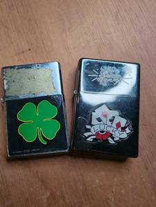 lot 1503 image: 2 Decorative Metal Lighters Four Leaf Clover Lucky Cards Design