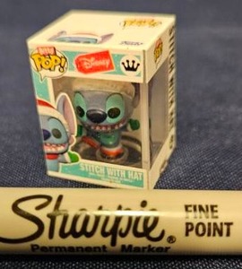 lot 224 image: Bitty Funko Pop Disney Stitch With Hat Figure