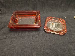 lot 1340 image: Two Red Glass Ashtrays with Decorative Scalloped Edges