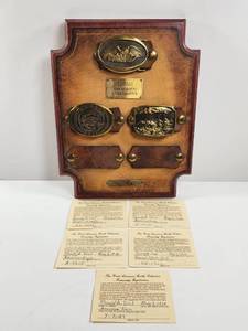 lot 99 image: Kansas Commemorative Buckle Collection Display with Belt Buckles and Registration Cards
