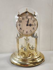 lot 105 image: Howard Miller Quartz Pendulum Table Clock with Glass Dome