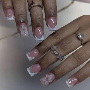 lot 614 image: CTTHNBD Short Press on Nails Square - White French Tip Fake Nails with Flower Design - Spring Stick on False Nails - for Women 24 Pcs - Retail $7
